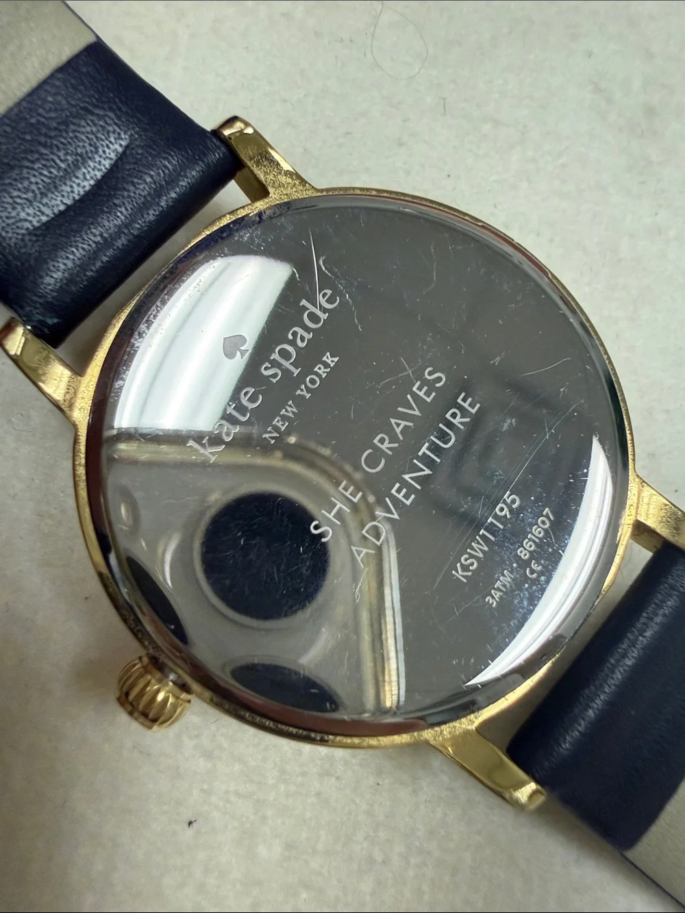 kate spade Gold-Tone Sagittarius Watch with Black Strap and Mother-of-Pearl Dial